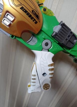 Трансформер стегозавр бластер, динозавр+ автомат с пулями