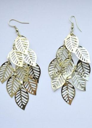 Елегантні довгі сережки золотистого кольору