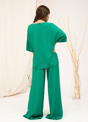 Зеленый льняной костюм с широкими брюками2 фото