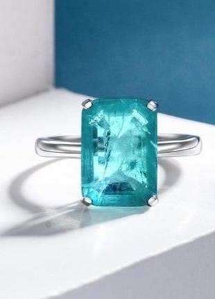 Серебряное новое кольцо с голубыми камнями6 фото