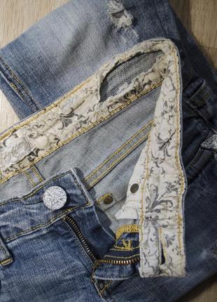 Фирменные джинсы с дырками4 фото