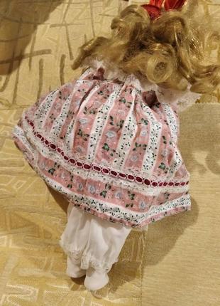 Лялька порцелянова кераміка блондинка кучерява в рожевому платті8 фото