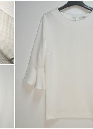 Стильная белая блуза с расклешенным рукавом next1 фото