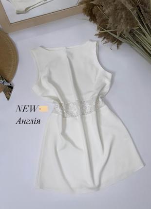 Платье мини без рукавов молочный цвет теплый белый1 фото