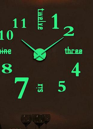 Настінний об'ємний 3d годинник великий який світиться у темряві з цифрами і написами англійською колір1 фото