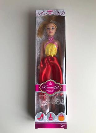 Лялька в красивій сукні (незначно потерта упаковка)4 фото