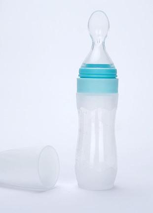 Бутылочка с ложкой силиконовая для кормления голубая blq09
