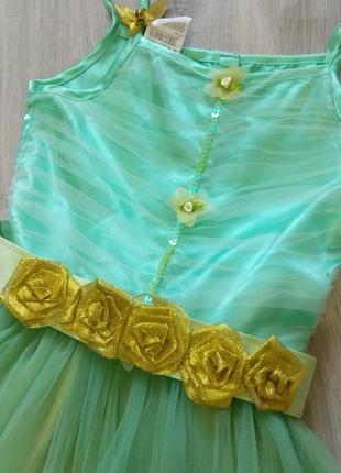 Фирменное нарядное платье для девочки.2 фото