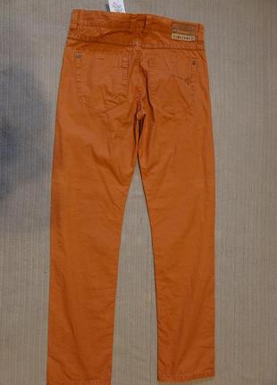Отменные фирменные кирпично оранжевые джинсы timezone германия 32/34.8 фото