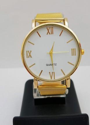 Новые женские часы кварц, под золото.1 фото