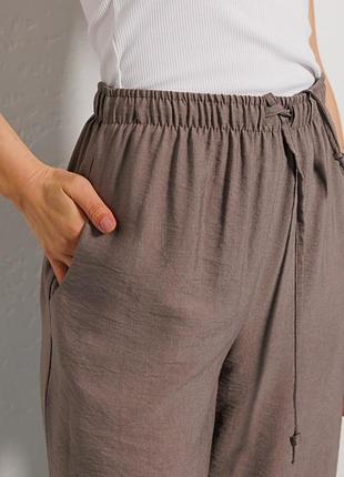 Женские легкие летние брюки с разрезами внизу разных цветов2 фото