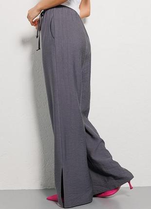 Женские легкие летние брюки с разрезами внизу разных цветов4 фото