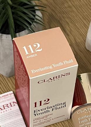 Оригинальный clarins everlasting youth fluid устойчивый тональный флюид с омолаживающим действием, spf 15 112 amber оригинал стоекий тональной флюид крем5 фото