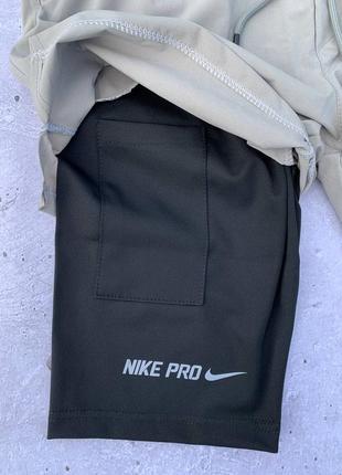 Бежеві чоловічі шорти nike pro3 фото