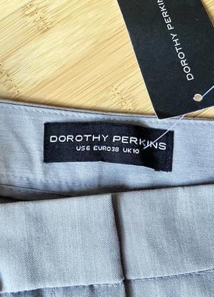 Легкие светло-серые брюки с боковыми карманами2 фото