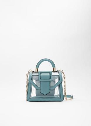 Чудова компактна голуба сумочка з прозорими вставками zara