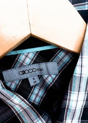 Мужская черная рубашка в клетку с карманами на заклепках от бренда g2ooman2 фото