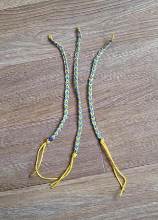 Сине-желтый плетеный браслет (24 см)2 фото