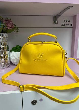 Желтая яркая трендовая стильная качественная сумочка кроссбоди производство украинской красиво держит форму
