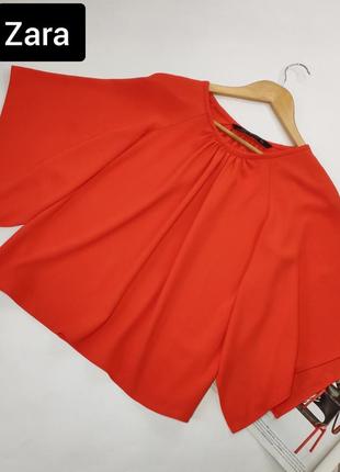 Блуза жіноча помаранчевого кольору вільного крою з широкими рукавами від бренду zara m