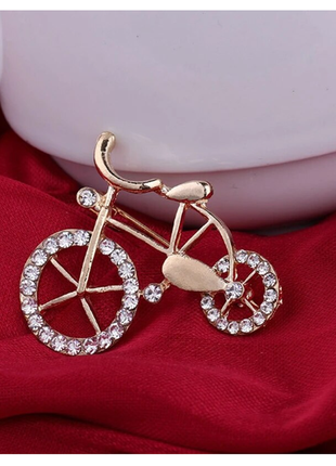 Золотиста брошка-велосипед зі стразами