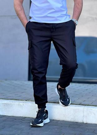 Чоловічі брюки карго базові штани з накладними карманами і резинкою спортивні чорні бежеві сірі хакі8 фото