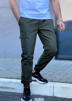 Чоловічі брюки карго базові штани з накладними карманами і резинкою спортивні чорні бежеві сірі хакі10 фото