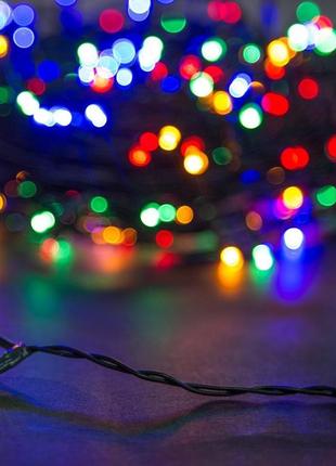 Новогодняя гирлянда с яркими разноцветными лампочками 10 метров и черным шнуром с вилкой для розетки "gr"4 фото