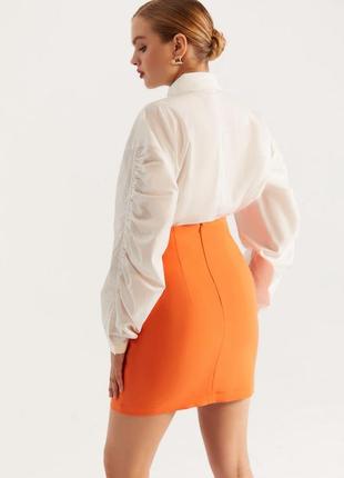 Короткая юбка со шнуровкой оранжевая3 фото
