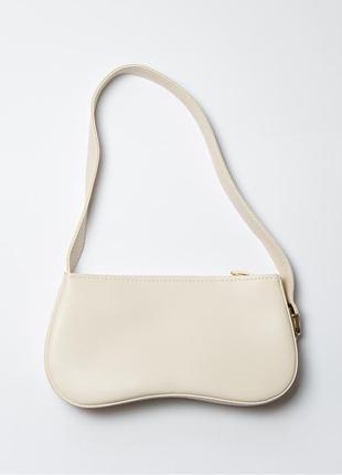 Жіноча сумка багет молочна