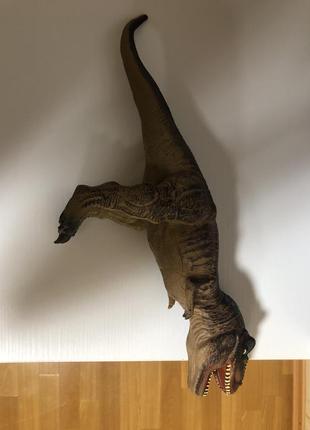 Резиновый динозавр игрушка3 фото