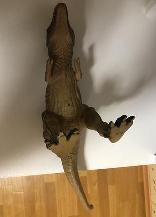 Резиновый динозавр игрушка9 фото