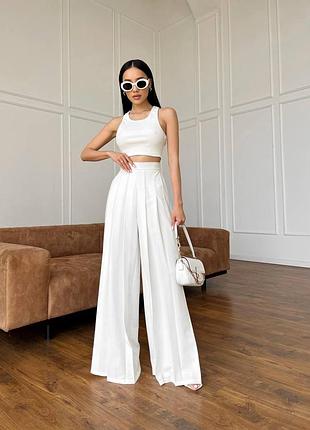 Шикарные оригинальные брюки палаццо со складками