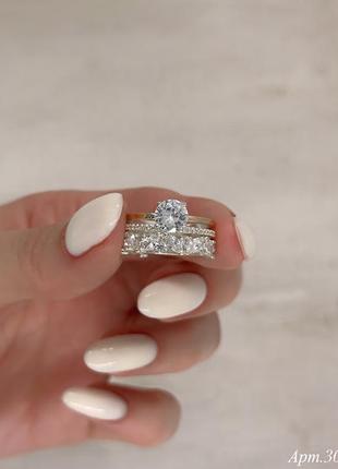 Серебряное двойное кольцо  с золотыми накладками и камнями1 фото