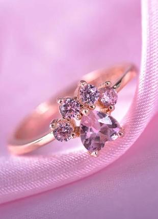 Кольцо pandora лапка вкрита рожевими камінцями пандора золото/срібло1 фото