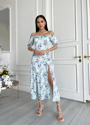 Это платье из шелка - настоящее произведение искусства, которое порадует вас своими элегантными линиями и нежными деталями