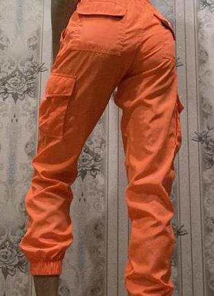 Оранжевые брюки с завышенной талией2 фото