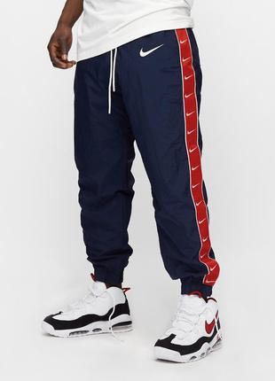 Спортивные штаны nike taped swoosh woven pant cd0421-451. оригинал1 фото