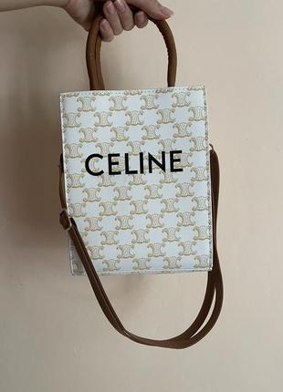 Бежева сумка в стилі celine з довгою ручкою та написом4 фото