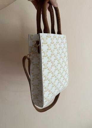 Бежева сумка в стилі celine з довгою ручкою та написом5 фото