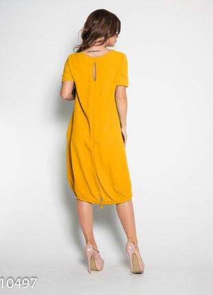 Желтое свободное платье с короткими рукавами3 фото