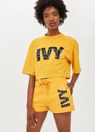 Помаранчевий топ ivy park9 фото