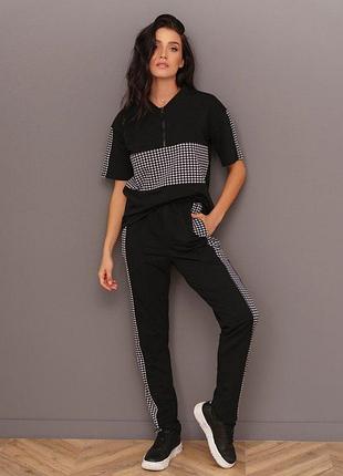 Чорний комбінований костюм із блискавкою