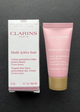 Многофункциональный антивозрастной защитный дневной крем clarins multi active jour для сияния кожи2 фото