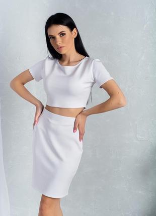 Женская классическая короткая трикотажная мини юбка, однотонная. белая 38