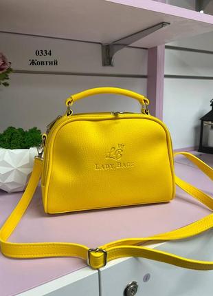 Жовта яскрава трендова сумочка кросбоді гарно тримає форму виробництво україна люкс якість