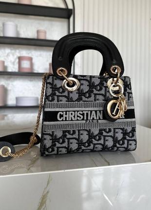 Жіноча сумка christian dior текстиль у сірому кольорі