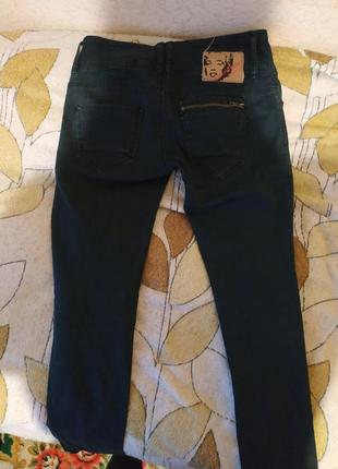 Чёрные, порванные джинсы3 фото