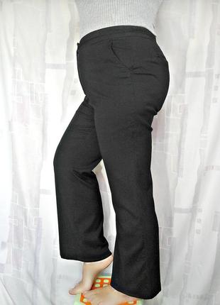 Класичні брюки з тканини в дрібну переполасу4 фото