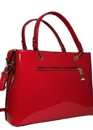 Женская сумка из лакированной эко кожи красного цвета3 фото